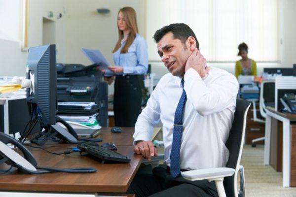 photodune-14094391-businessman-working-at-desk-suffering-from-neck-pain-xs