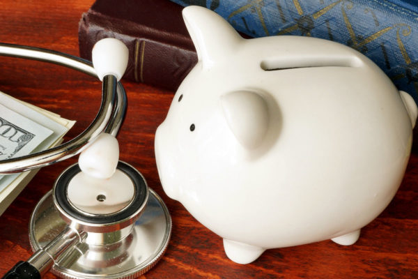 Piggy Bank and stethoscope on a desk